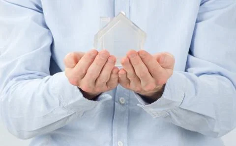 Home in hands Stock Photos