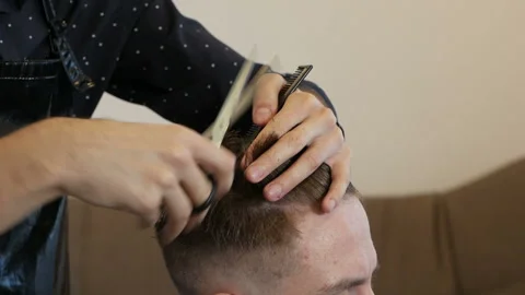 At home handsome guy have a professional haircut Stock Footage 149762404