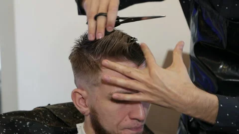 At home handsome guy have a professional haircut Stock Footage 149762977