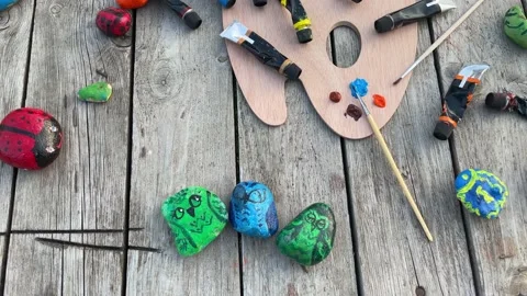 Home hobbies are authentic. Artwork on stones. Stock Footage 209627445