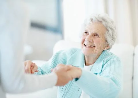 Home, holding hands and help up with senior woman, physiotherapy and happy for r Stock Photos