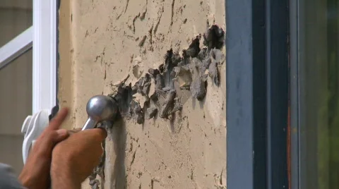Home improvement, #27 pneumatic hammer on stucco Stock Footage
