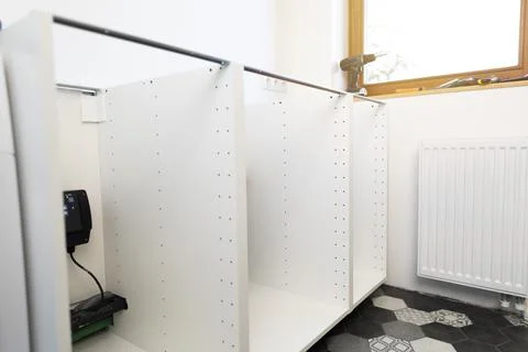 Home improvement assembling a kitchen unit, frame of a closet Stock Photos