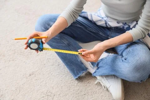 Home improvement project planning with measuring tape and pencil, DIY renovat Stock Photos