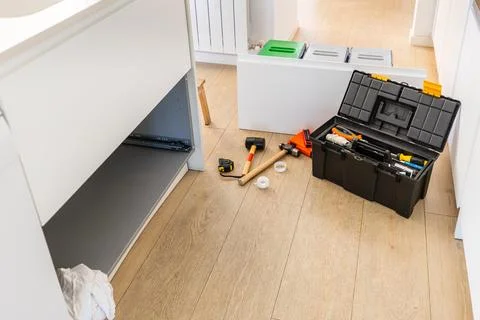 Home improvement project with toolbox and tools on floor Stock Photos