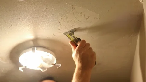 Home improvement - Scraping ceiling material Stock-Footage 95766990