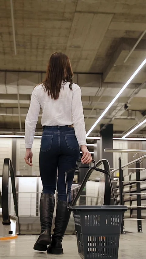 Home improvement store. Beautiful young woman customer in the in the big city Stock Footage 277410446