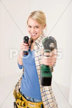 Home improvement - woman with battery screwdriver Stock Photos