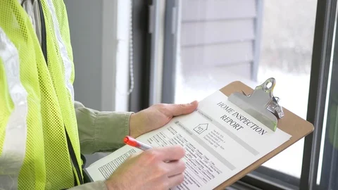 Home Inspection Being Filled on a Notepad by The Inspector Stock Footage 103782166