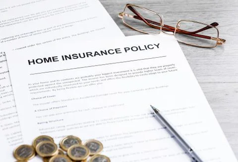 Home Insurance Policy. Notes, Model of House and Insurance Policy Stock Photos