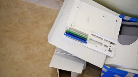Home intercom in open cardboard packaging box on the floor. Stock Footage 51876038