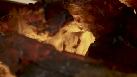 Home interior. Close-up shot of warm cozy burning fire in electric fireplace. 4K Stock-Footage 86547795