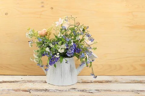 Home interior with decor elements, beautiful spring garden flowers in a va... Stock Photos