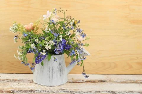 Home interior with decor elements, beautiful spring garden flowers in a va... Stock Photos