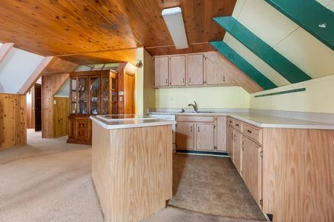 A home kitchen with countertop and cabinets Stock Photos
