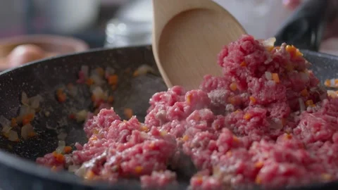 Home kitchen. in a frying pan with vegetable oil fry minced meat, onions and 스톡 동영상 145390184