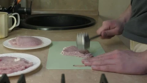Home kitchen meat tenderizing Stock Footage 326173371