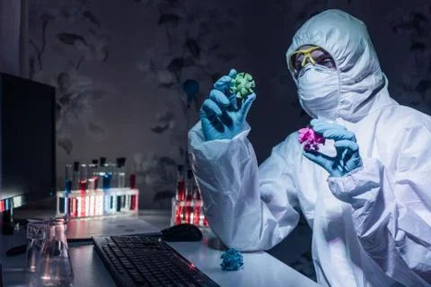 Home laboratory. Biologist develops a cure coronaviruses infection. Stock Photos
