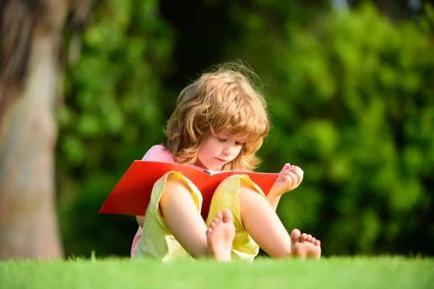 Home learning. Child distance learning using pencil to practice writing on a Stock Photos
