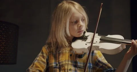 Home lesson boy kid playing the violin. Creative music activities for children Stock Footage 148483610