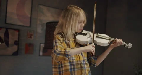 Home lesson boy kid playing the violin. Creative music activities for children Stock Footage