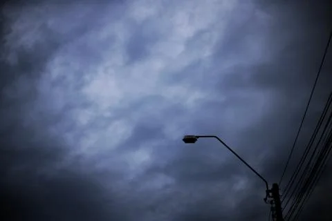 Home level Voltage electric power lines. silhouette electrical light pole and Stock Photos