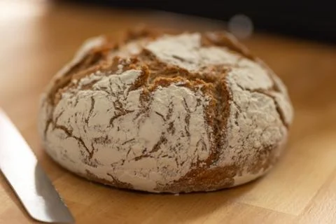 Home made bread with a knife Stock Photos