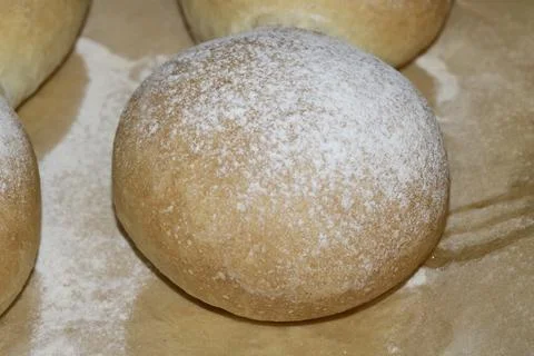 Home made bread roll baps freshly cooked with flour sprinkled on top Stock Photos