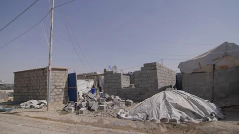 Home made with bricks in a refugee camp in Sulaymaniah - Iraqi Kurdistan Stock Footage 75908644