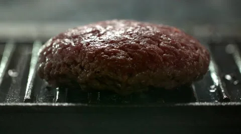 Home made burger on a griddle pan. Slow Motion. Stock Footage 41203821