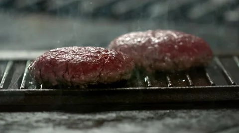 Home made burger on a griddle pan. Slow Motion. Stock Footage 41203863