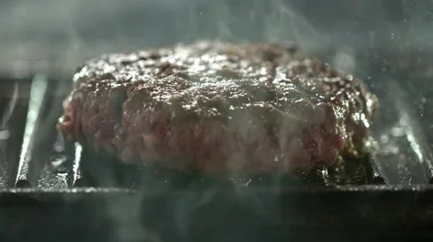 Home made burger on a griddle pan. Slow Motion. Stock Footage 41203897