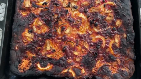 Home Made Burnt Pizza In The Kitchen Stock Footage 202309081