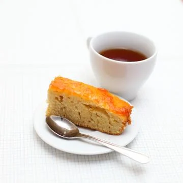 A home-made cake with a cup of tea Stock Photos