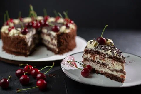 Home made cherry cake with vanilla and black cherries on wooden table Stock Photos