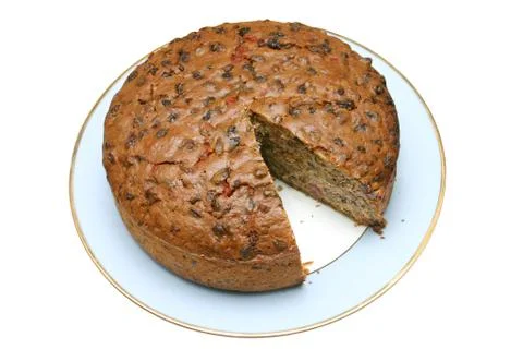 Home made fruit cake with a slice missing. Stockfoto's