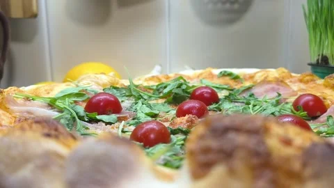 Home made pizza with cherry tomatoes and mozzarella cheese.  High-quality photo Stock Footage 285447344