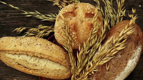 Home Made Traditional Bread and wheat on the table Stock Footage 247487345