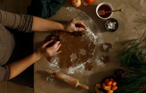 Home making Christmas gingerbread in the different form on a brown background Stock Photos