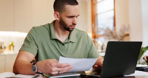 Home, man and reading with document on laptop for tax, invoice and bank Foto stock