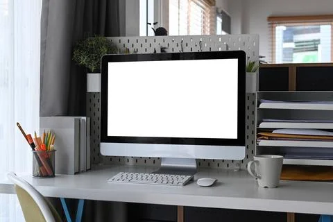 Home office desk with computer and supplies. Stock Photos