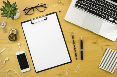 Home office desk workspace with with silver notebook, smartphone and office Stock Photos