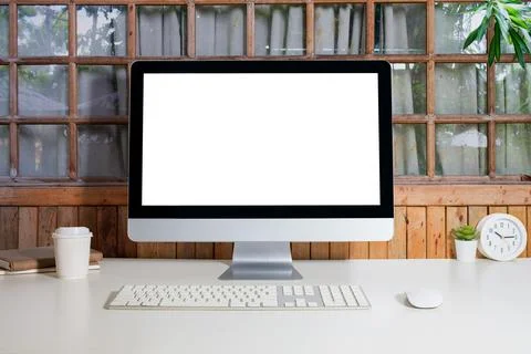 Home office interior with blank computer monitor and office supplies on whi.. Stock Photos