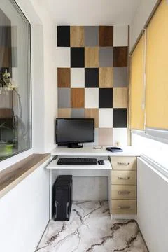 Home office on the loggia. Interior of the study on the balcony. Stock Photos