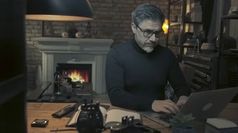 Home office - man working from home at night with laptop Видео 148032553