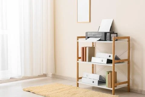 Home office printer and document storage shelf with white curtains and light  Stock Photos