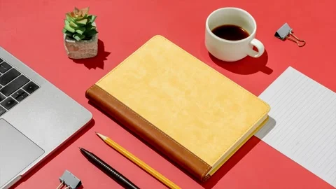In the home office on a red table a notebook Stock Footage 220601063
