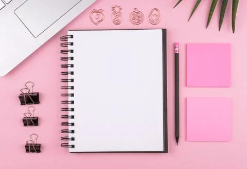 Home office, stationery, Notepad, computer, flower on pink background, copy Stock Photos