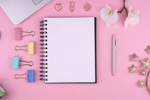Home office, stationery, Notepad, computer, flower on pink background, copy s Stock Photos