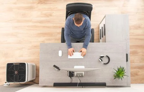 Home Office Worker in Front of Computer Top View Фото